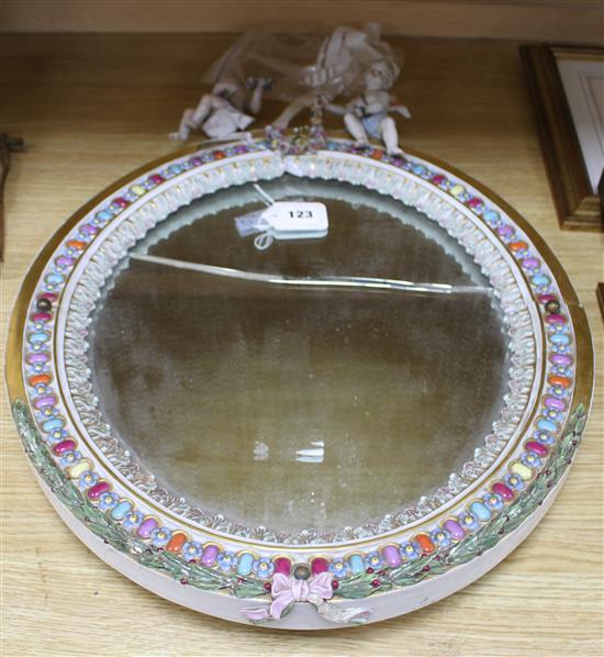 A Meissen porcelain dressing table mirror, surmounted with cherubs (a.f.), overall height 56cm